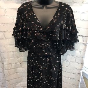 Women’s short sleeve mock wrap dress.